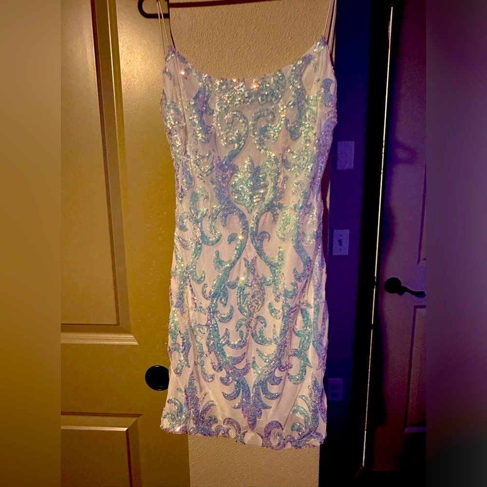 White and silver dress snatches the body perfectly